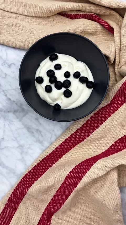 Garnishing yogurt with berries Stock Footage 335698510