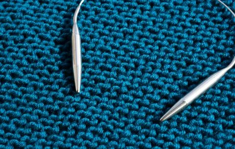 Garter knitting. The pattern is knitted with large knitting needles from se.. Stock Photos
