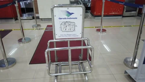 Garuda Indonesia Test Unit For Cabin Baggage at Sam Ratulangi Airport Stock Footage 130203869