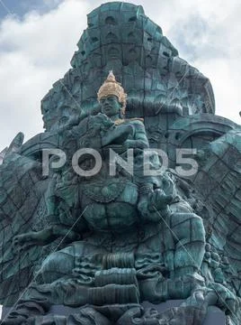 Garuda Wisnu Kencana GWK Bali monument at sunny day with blue sky and clouds Stock Photos
