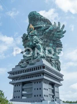 Garuda Wisnu Kencana GWK Bali monument at sunny day with blue sky and clouds Stock Photos