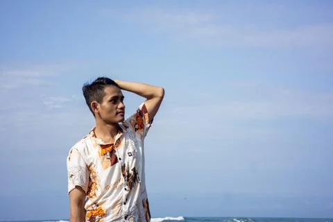 Garut, West Java – 2024, May 22: asian young man is taking photos using a phone Stock Photos