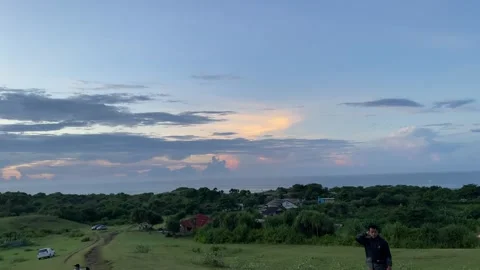 Garut West Java, May 12, 2025 A stunning view of the sunrise over the vast green Stock Footage 309908995