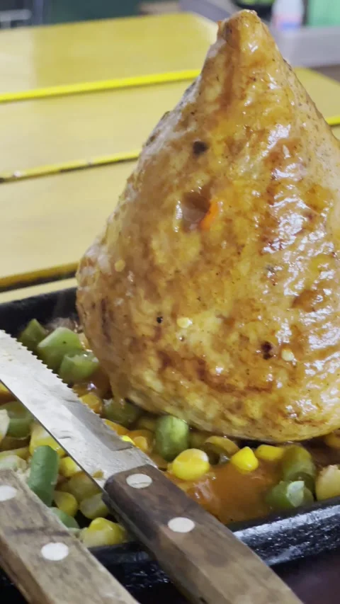 Garut, West Java, May 26, 2025, jumbo-sized meatballs are eaten and then served. Stock Footage 310182603