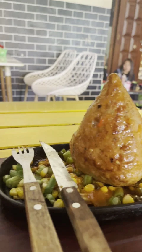 Garut, West Java, May 26, 2025, jumbo-sized meatballs are eaten and then served. Stock Footage 310182798