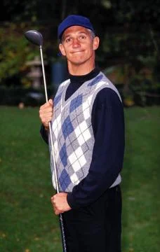  GARY LINEKER Ref: 11303 playing golf, argyle, flat cap, golf club in hand... Stock Photos