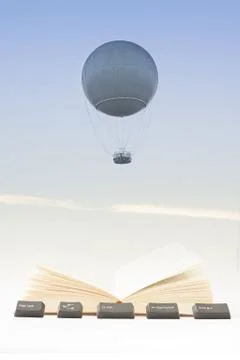 Gas Balloon, Book, Computer Keys Against the Sky Stock Photos