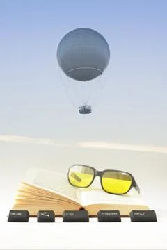 Gas Balloon, Book, Computer Keys and Sunglasses Against the Sky Stock Photos