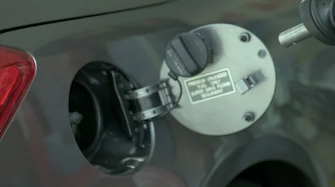 Gas being Pumped - Hand Pumping Gas into Car Tank at Gas Station in Slow Motion Stock Footage 37663247