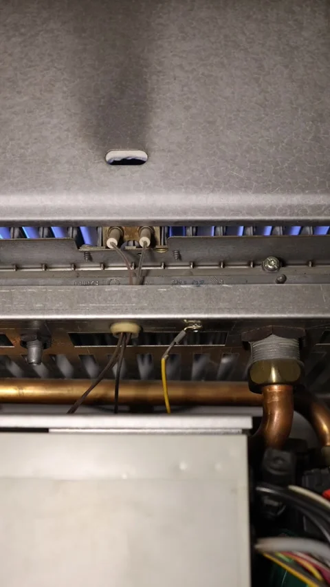 Gas boiler fires up as falling temperatures bring household heating back Stock Footage 344054803