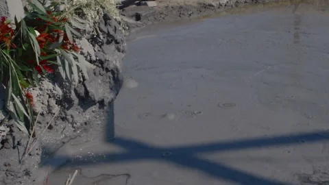 Gas bubbles emerging from an oil mud volcano in Myanmar Stock Footage 332764561