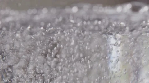 Gas bubbles going up in water. Boiling water. Stock Footage 199473918