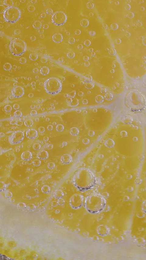 Gas bubbles on lemon 스톡 동영상 237706263