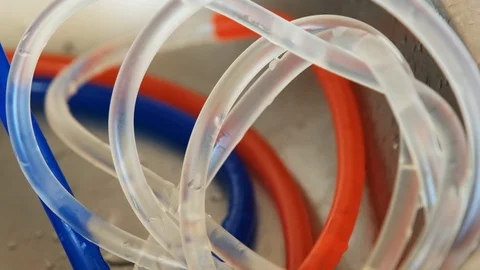 Gas bubbles move in liquid along curved tubes Stock Footage 129847846