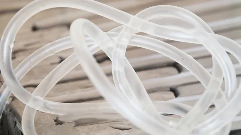 Gas bubbles move in liquid along curved tubes Stock Footage 129849556