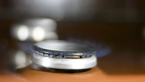 Gas burner ignites. Fire ignites on the stove Stock Footage 123347136