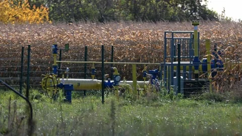 A gas compression station with multiple pipelines and industrial equipment .. Stock-Footage 323791414