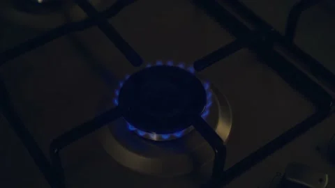 Gas cooker with burning weakly flames of blue propane gas Stock Footage 202534199