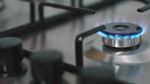 Gas cooker with flames burning in the kitchen Video stock 255800071