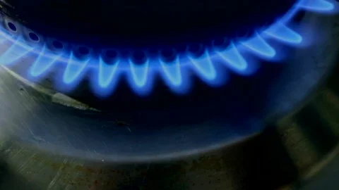 Gas cooker ignition flames light up from above Stock Footage 103428262