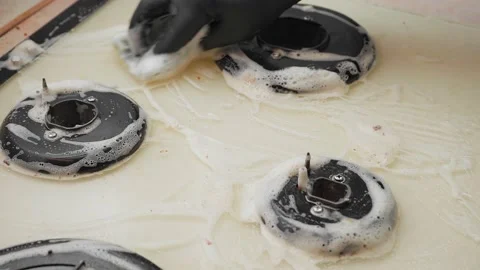 The gas cooking panel is washed with a foam sponge Video stock 152931535