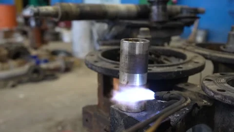 Gas cutter with copper nozzle with a stream of fire directed at the metal Video stock 300760267