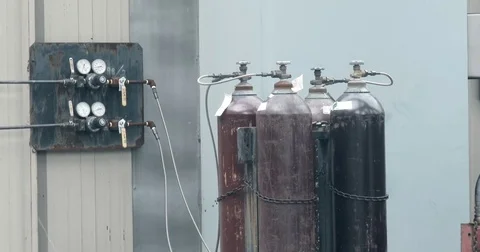 Gas Cylinders Hooked up Outside - 4k Stock Footage 72712706
