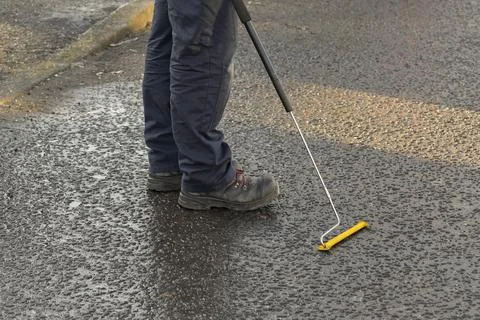 Gas Engineer Wearing PPE Using Long Handle Combustible Gas Leak Detector Stock Photos