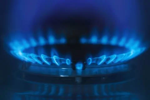 Gas flame on dark background. Stock Photos