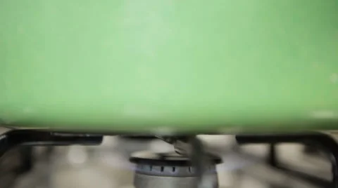 Gas Flame, Stove, with pot. camera tilt. Stock Footage 46257612