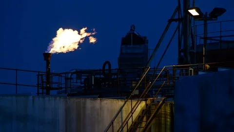 Gas flare stack burning excess gases at petrochemical plant selby united kingdom Stock Footage 125015877