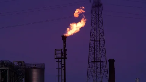 Gas flare stack burning excess gases at petrochemical plant selby united kingdom Stock Footage 125016319