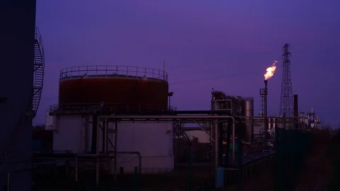 Gas flare stack burning excess gases at petrochemical plant selby united kingdom Stock Footage 125017635
