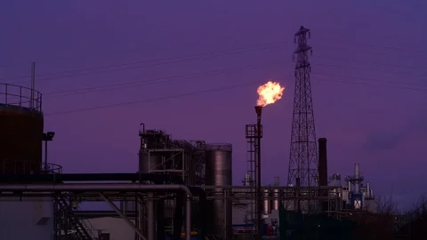Gas flare stack burning excess gases at petrochemical plant selby united kingdom Stock Footage 125019578