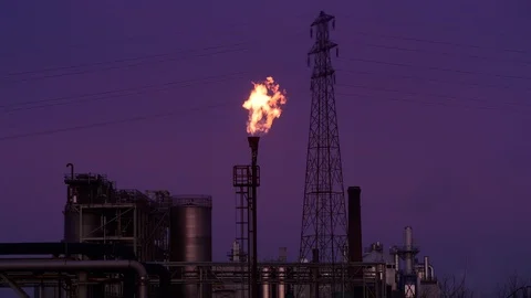 Gas flare stack burning excess gases at petrochemical plant selby united kingdom Stock Footage 125020033