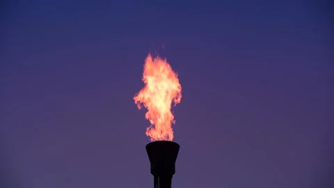 Gas flare stack burning excess gases at petrochemical plant united kingdom Stock Footage 191051314