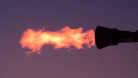 Gas flare stack burning excess gases at petrochemical plant united kingdom Stock Footage 191073503