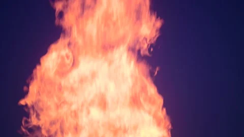 Gas flare stack burning excess gases at petrochemical plant united kingdom Stock Footage 213555397