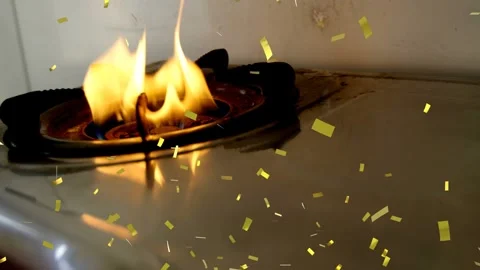 Gas flow increasing, burner flame growing and shifting to yellow, gold sparks Stock Footage 323119073