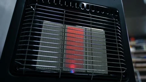 The gas heater works in the workshop at the minimum heating level. Smooth Stock Footage 280586389