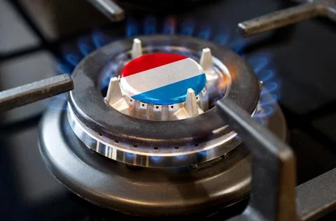 Gas import and export concept. A burning gas burner of a home stove, in the m Stock Photos