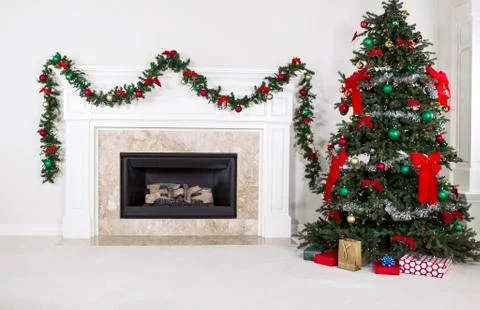 Gas insert fireplace in use during holidays Stock Photos