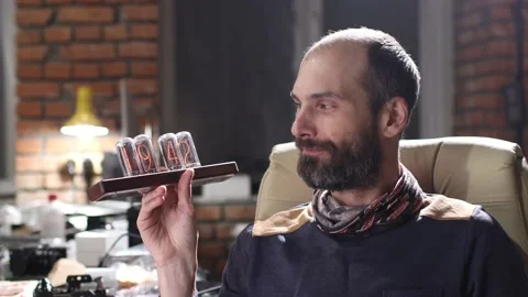 Gas lamp digital lamp clock indicators hold bearded man. Stock Footage 169652204