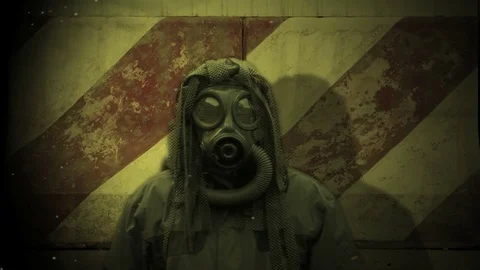 Gas mask guy against wall Stock Footage 72132005