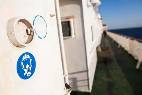 Gas mask sign on a white wall Stock Photos