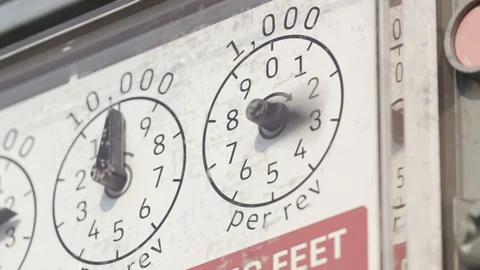 "A gas meter gauges in closeup camera. Fast fuel flow shown in a timelapse. Stock Footage 97960404