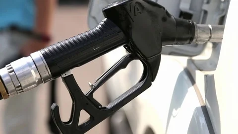 Gas nozzle in a car Stock Footage 73004409