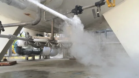 Gas or steam leaking from storage tank industrial Stock Footage 47940802