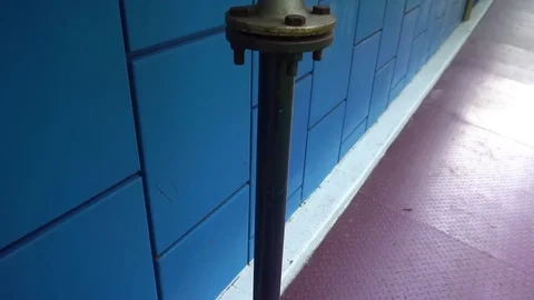 The gas pipe on the background of blue wall Stock Footage 75915462