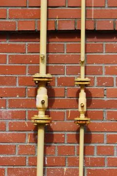 Gas pipe on the wall Stock Photos